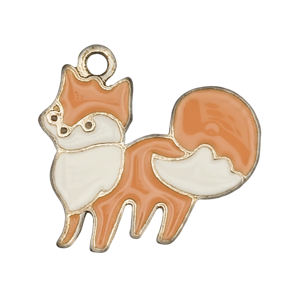 close-up of an orange and white enamel fox charm with gold outline
