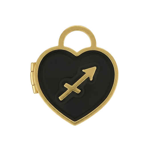 close-up of a heart-shaped black enamel charm with a Sagittarius arrow symbol and gold-tone edges