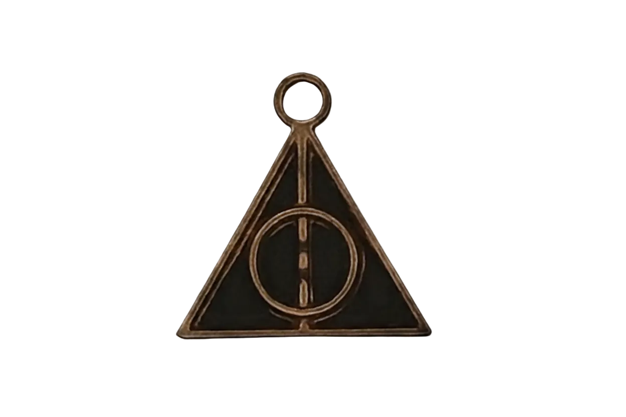 close-up bronze triangle charm with circle and line on black background