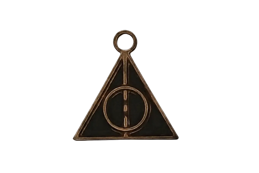 close-up bronze triangle charm with circle and line on black background