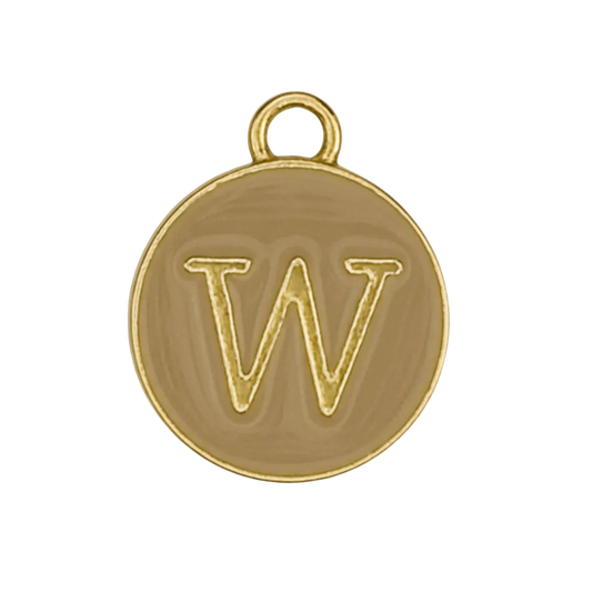 close-up of a gold round charm with letter W