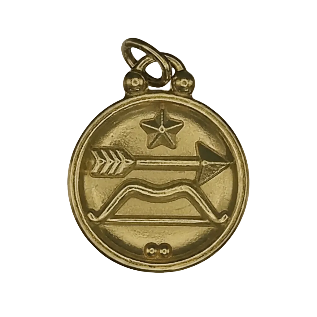 close-up of round gold charm with bow and arrow and star motif