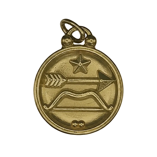 close-up of round gold charm with bow and arrow and star motif