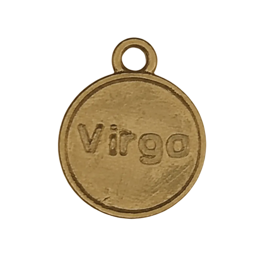close-up of round gold-tone charm engraved 'Virgo' on a black background