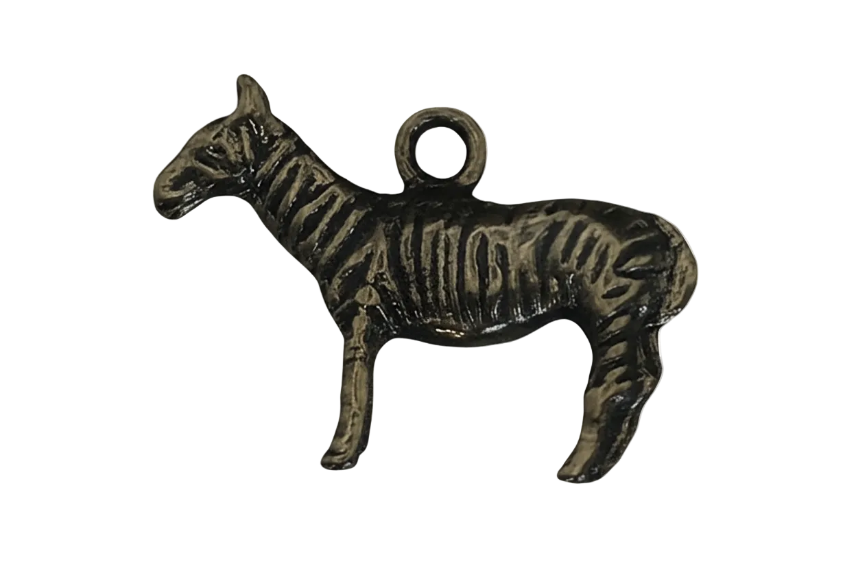 close-up of antique brass zebra charm