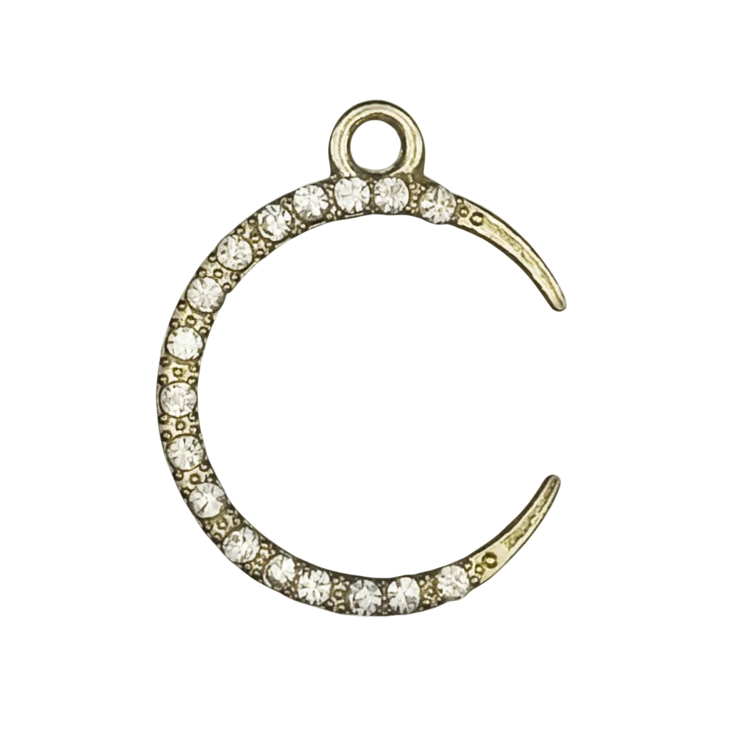close-up gold-tone crescent moon charm with clear pave crystals on black