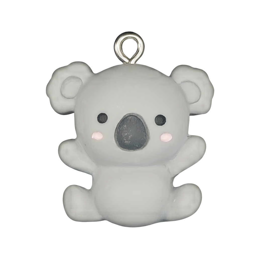 close-up of small gray koala charm with pink cheeks on black background