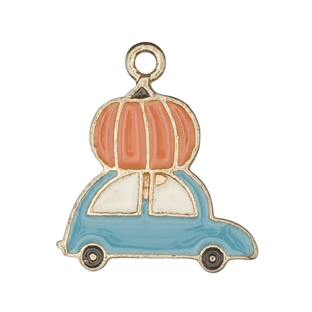 close-up of enamel charm shaped like a blue car with an orange pumpkin on top