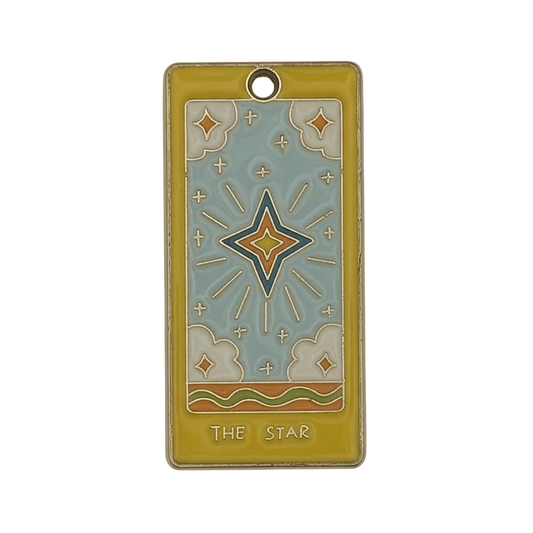 rectangular yellow-border tarot star enamel charm on black background