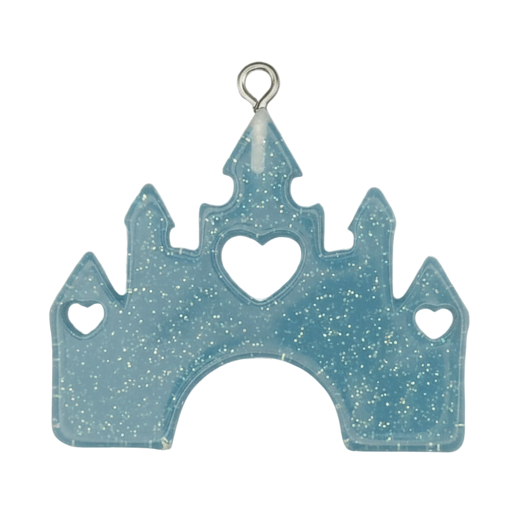 close-up of blue glitter castle charm with heart cutouts on black background