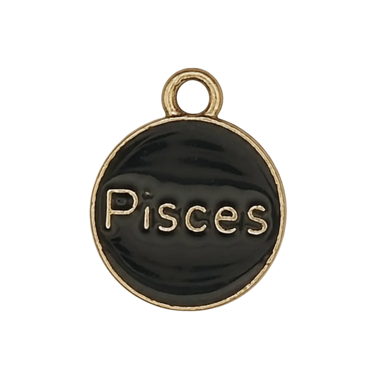 Close-up of round black and gold Pisces charm