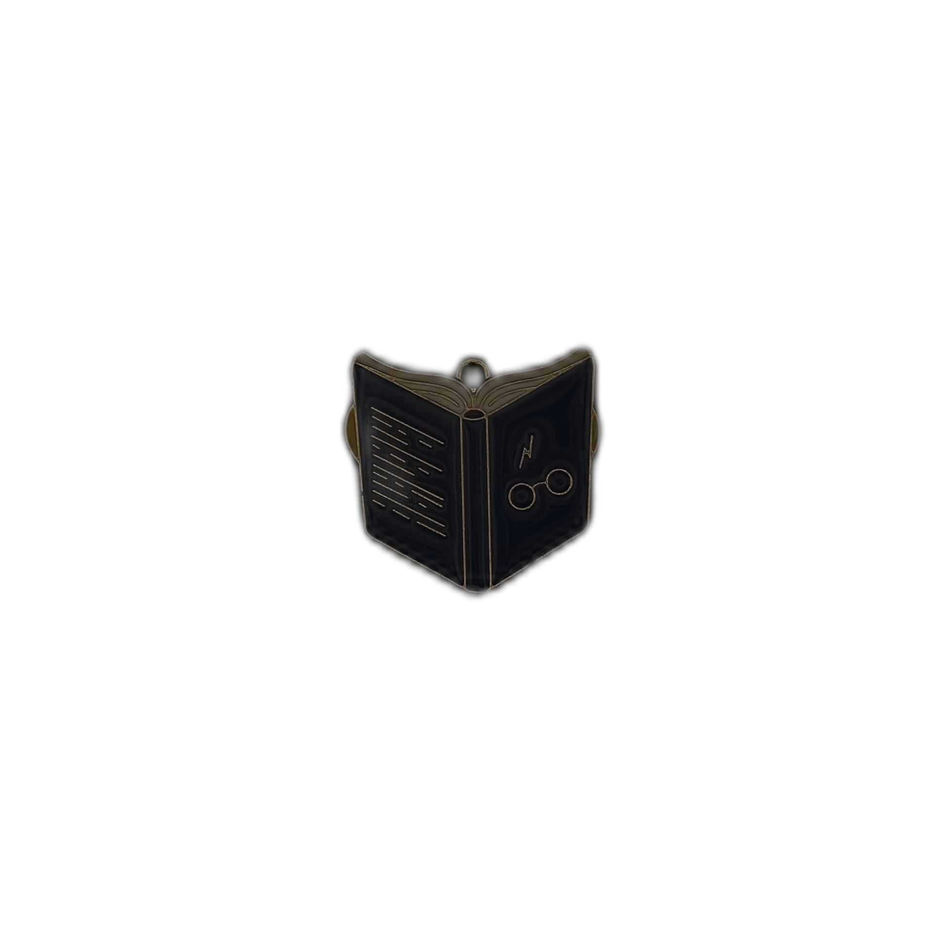 Small open book enamel charm with gold outlines on a plain background.