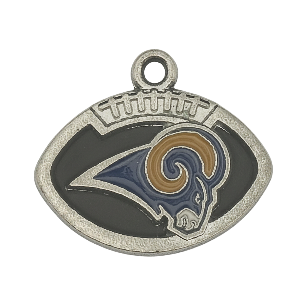 close-up of football-shaped charm with ram head in navy and gold