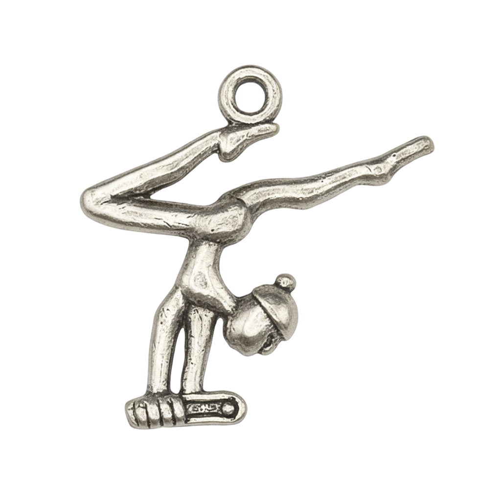 silver-tone figure skater charm in arabesque on black background