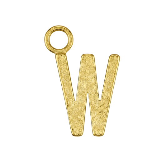 close-up of small gold letter W charm on black background