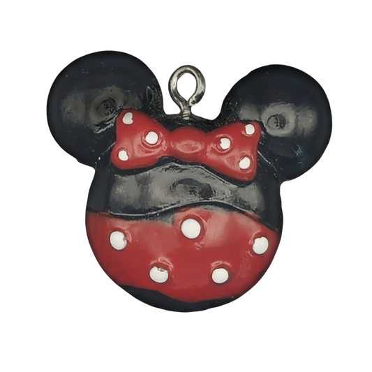 close-up of black and red mouse head charm with red bow and white polka dots