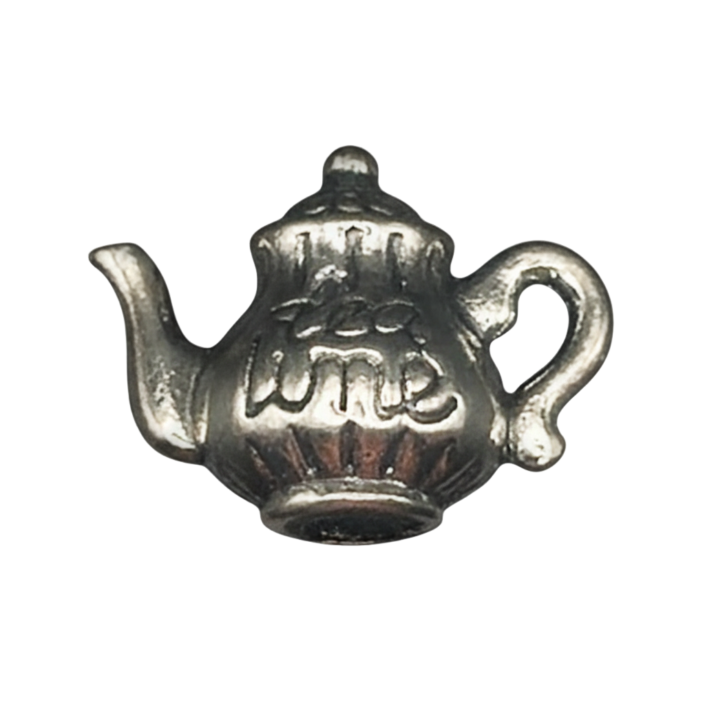 close-up of a small silver teapot charm