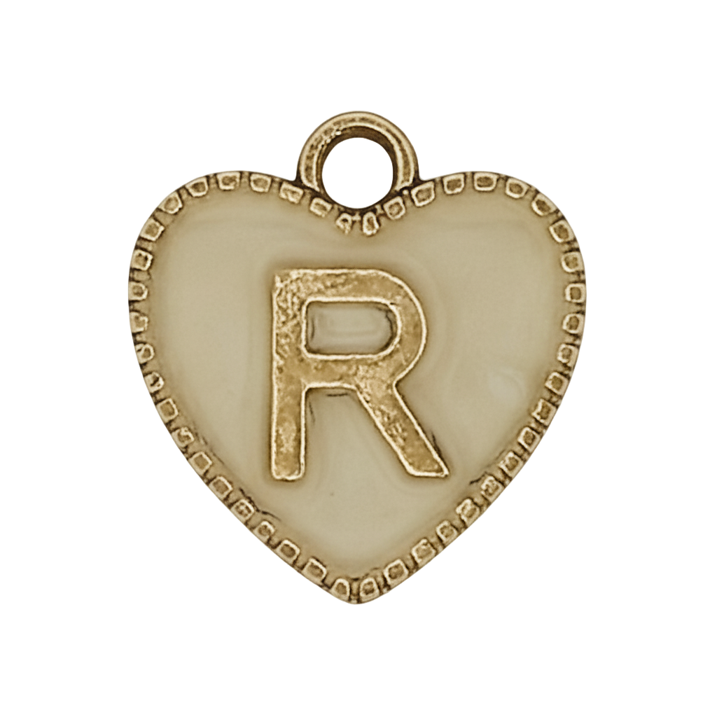 close-up of cream heart charm with gold letter R