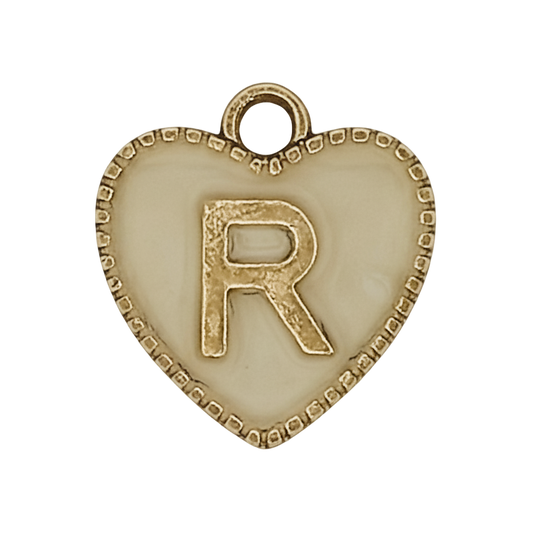 close-up of cream heart charm with gold letter R