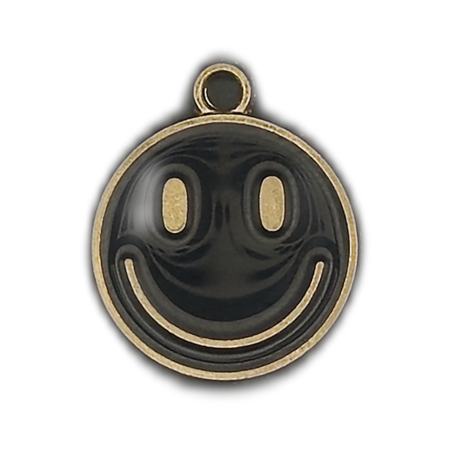 close-up of round black and gold smiley face charm