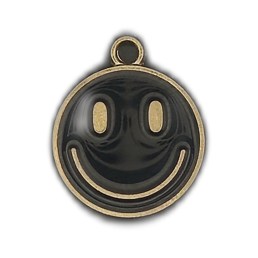 close-up of round black and gold smiley face charm