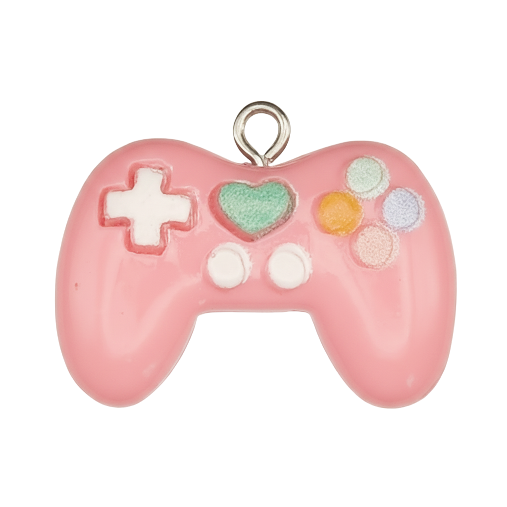 close-up of pink enamel game controller charm with green heart and pastel buttons