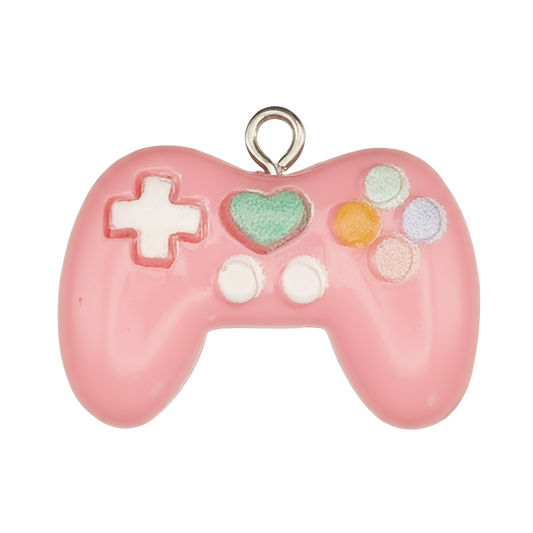 close-up of pink enamel game controller charm with green heart and pastel buttons