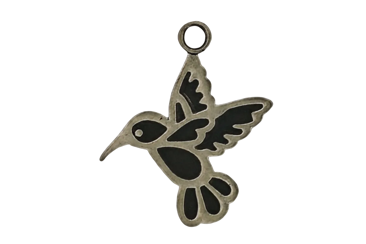 gold-tone hummingbird outline charm with dark accents on a black background