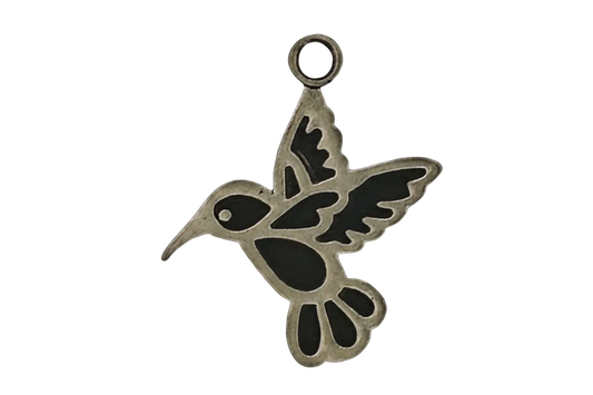 gold-tone hummingbird outline charm with dark accents on a black background