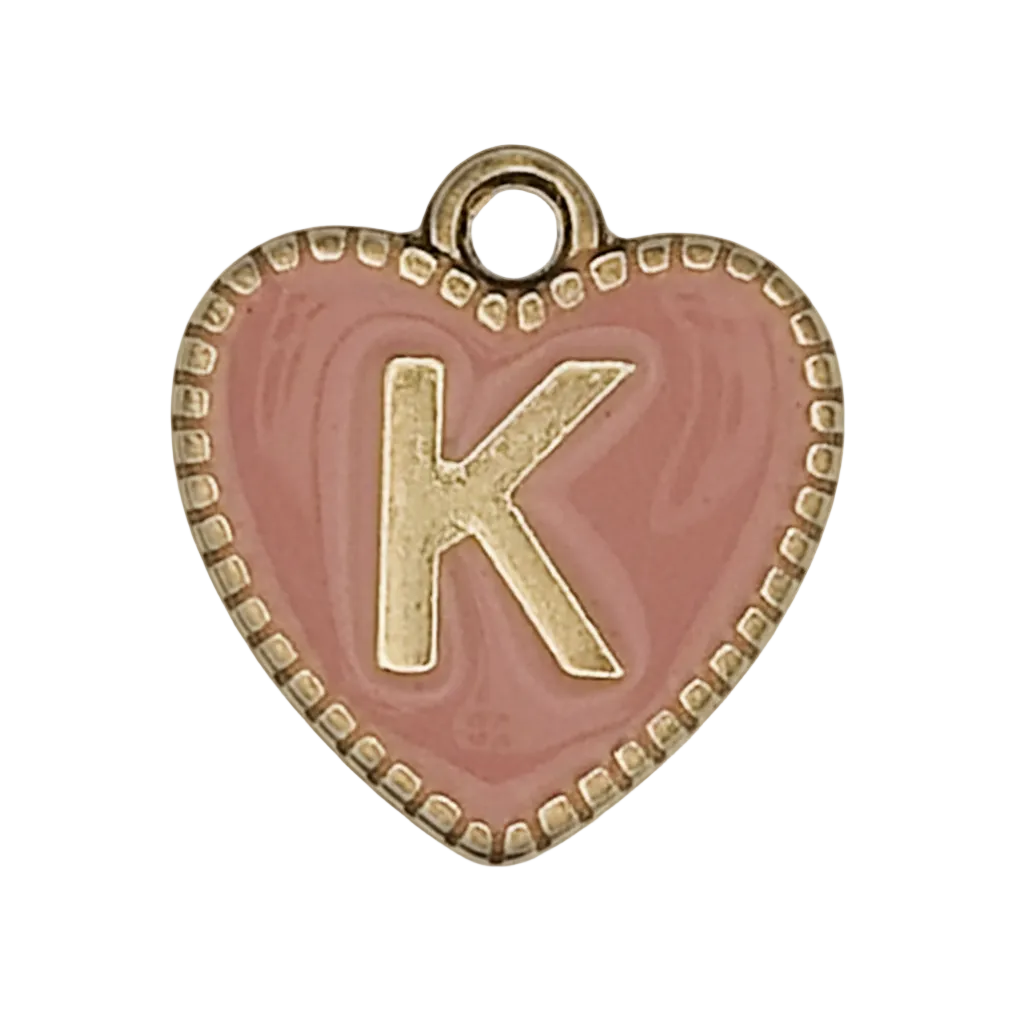 close-up of pink heart charm with gold letter K