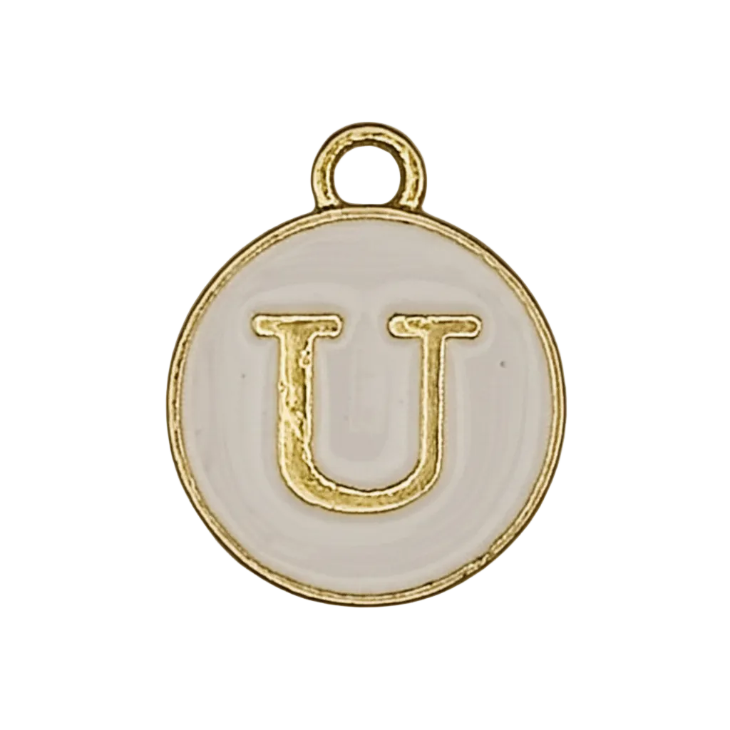 Close-up of a round white enamel charm with a gold letter U.