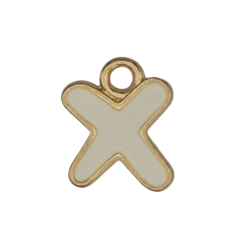 close-up of small white enamel letter X charm with gold outline
