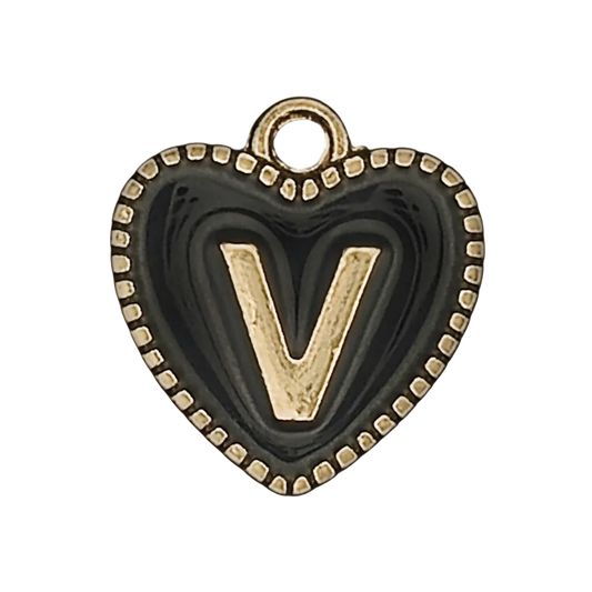 close-up of a black heart charm with a gold V and beaded border