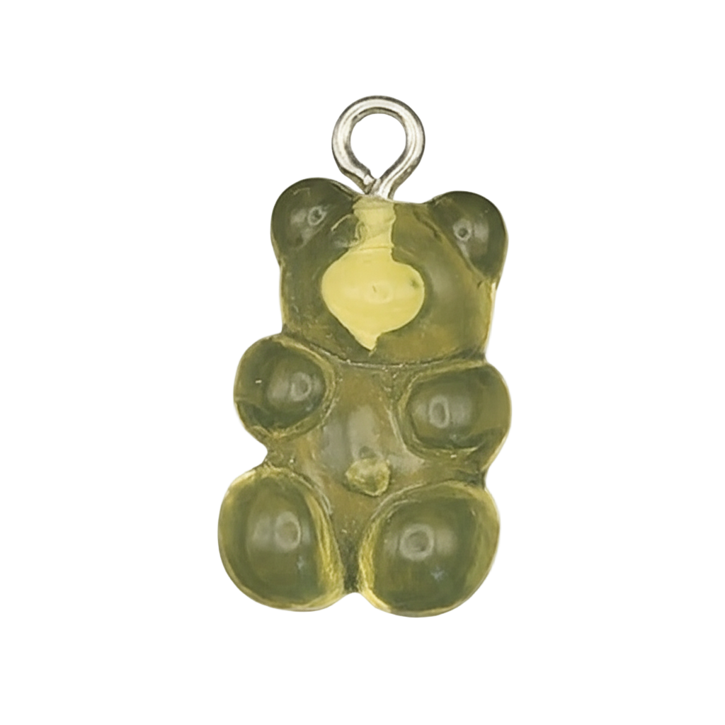 close-up of translucent green gummy bear charm on black background