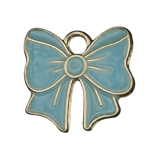 close-up of a blue enamel bow charm with gold-tone outline on a black background