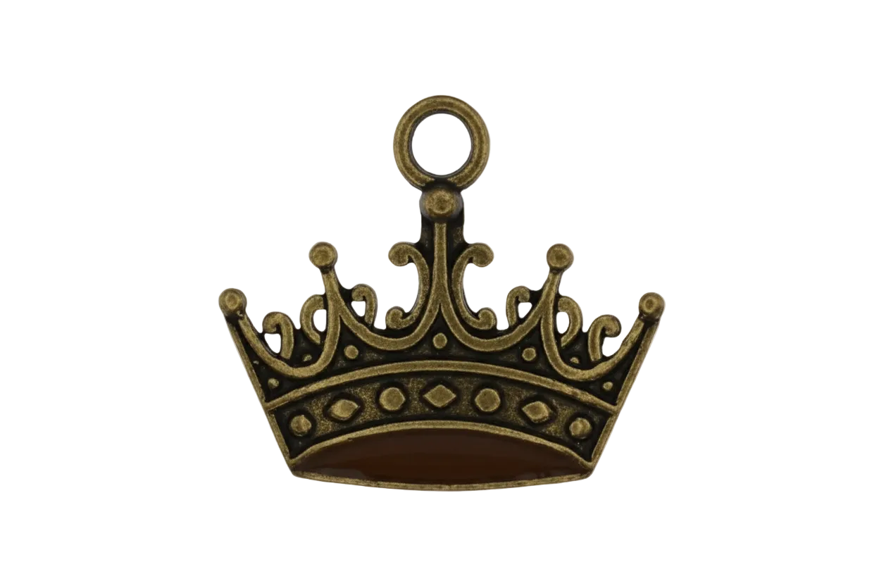 close-up of antique gold crown charm on black background