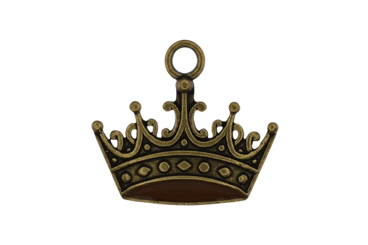close-up of antique gold crown charm on black background