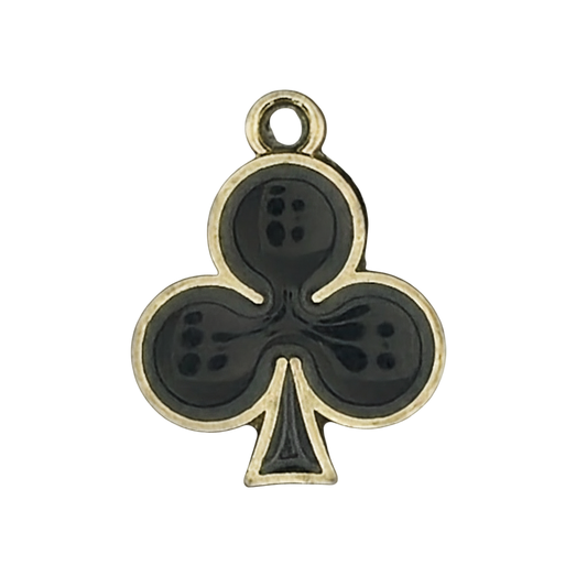 close-up of black club suit charm with gold border on a black background