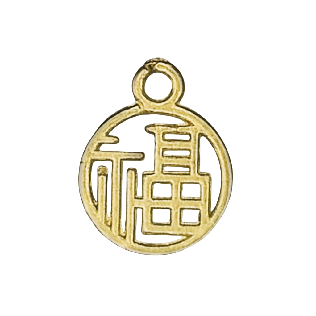 close-up of a round gold-tone charm with a Chinese character on a black enamel disc