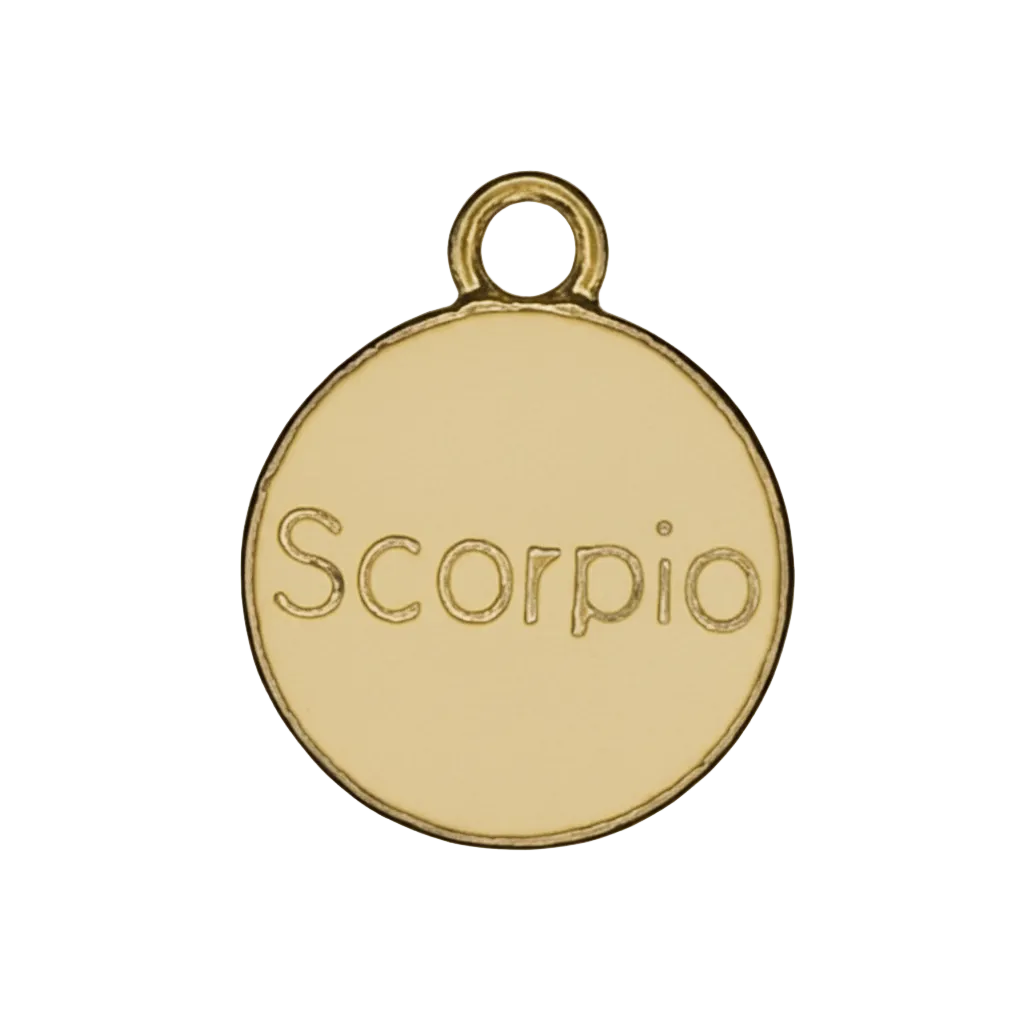 Close-up of a gold round charm engraved with the word Scorpio on a black background.