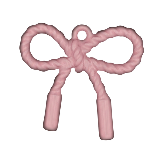 close-up of pink rope-textured bow charm on black background