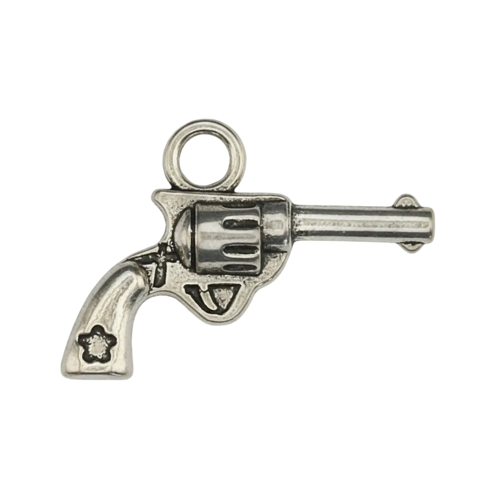 close-up of a small silver revolver-shaped charm on a black background