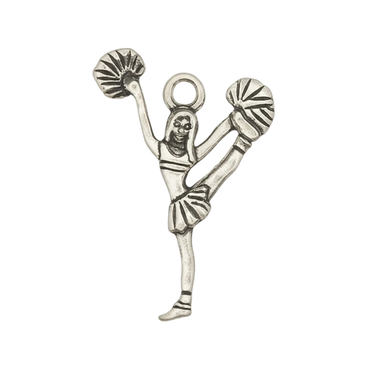 silver-tone cheerleader charm with raised leg and pom-poms on black background