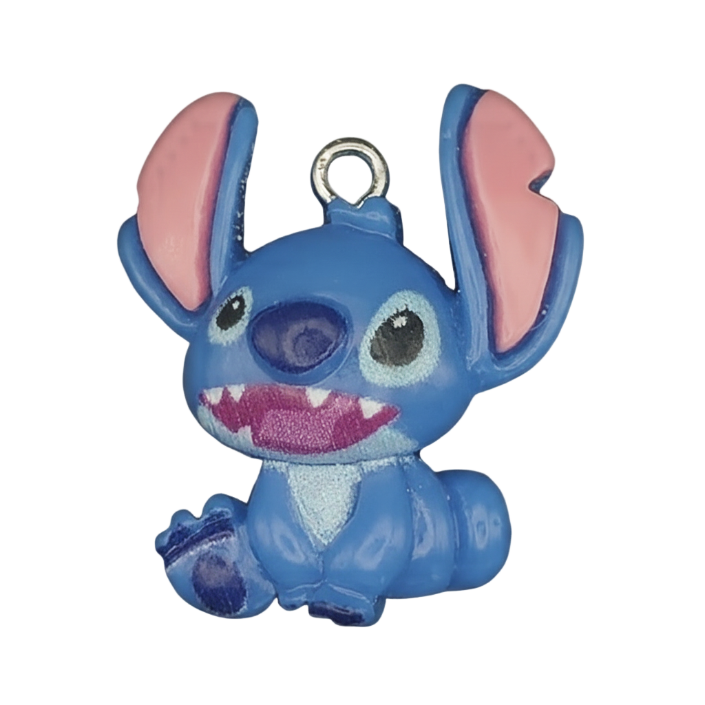 close-up of blue alien character enamel charm with big ears on black background