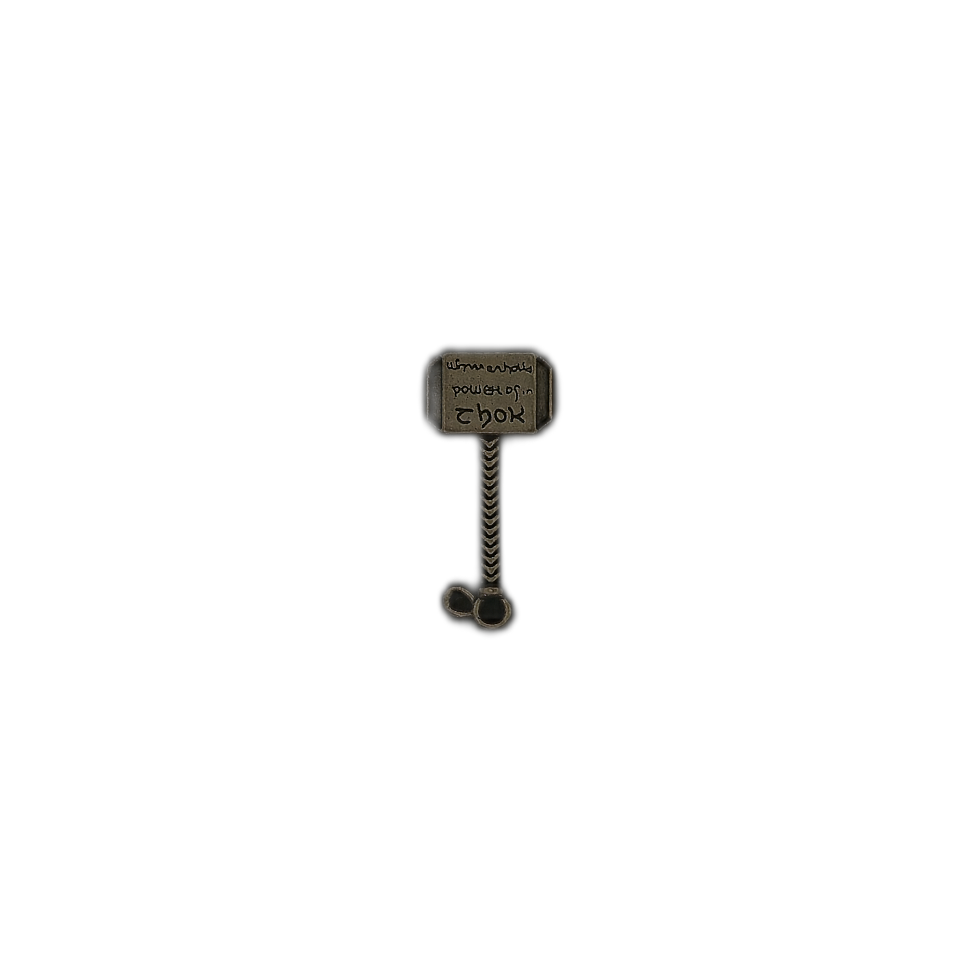small antique brass hammer charm centered on a black background