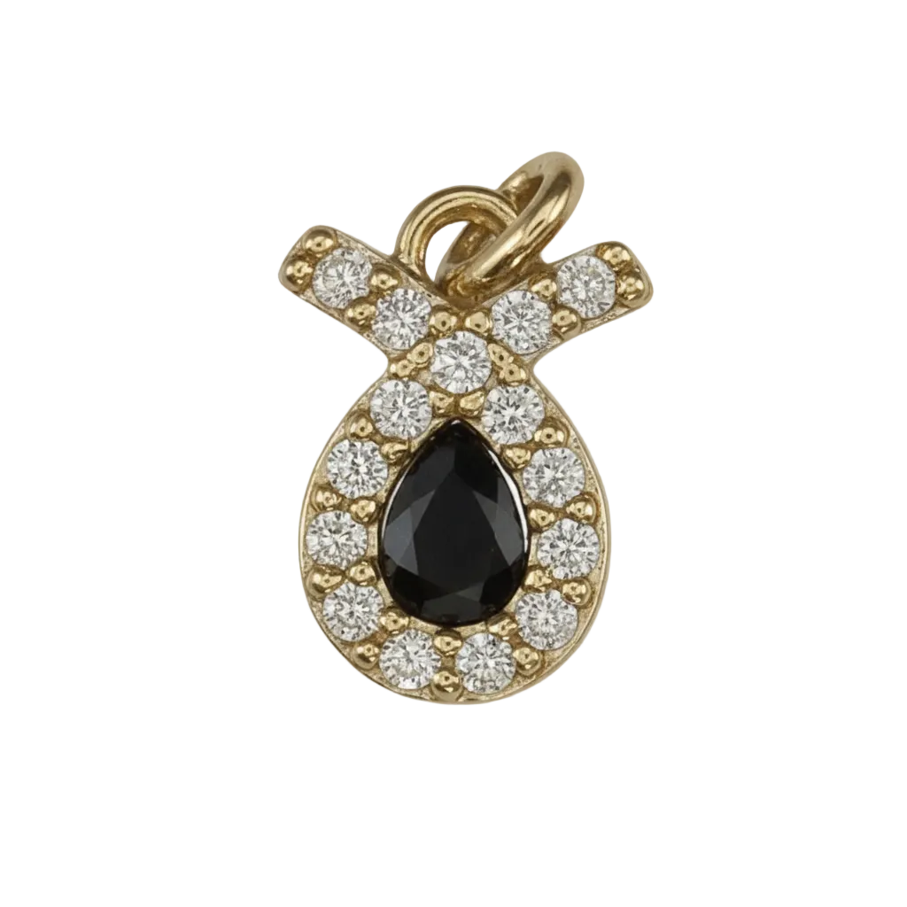 close-up of a small gold-tone pavé ribbon charm with clear stones on a black background