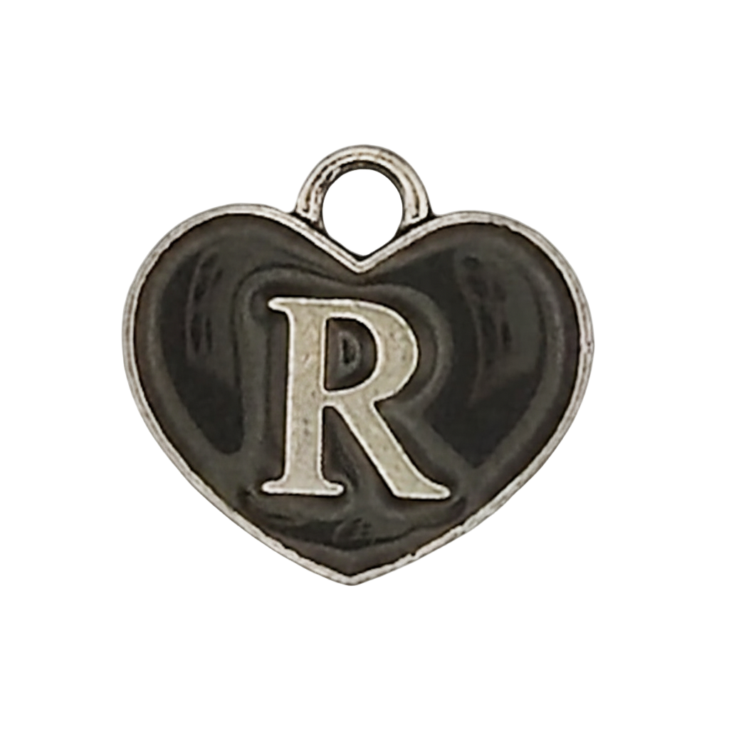 close-up of black heart charm with silver letter R
