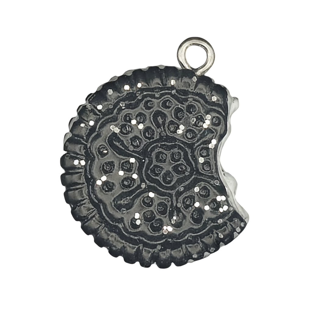 close-up of a small bitten sandwich cookie charm in dark silver