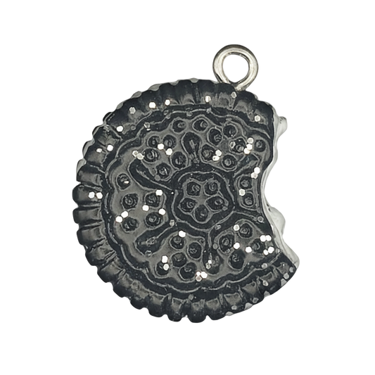 close-up of a small bitten sandwich cookie charm in dark silver
