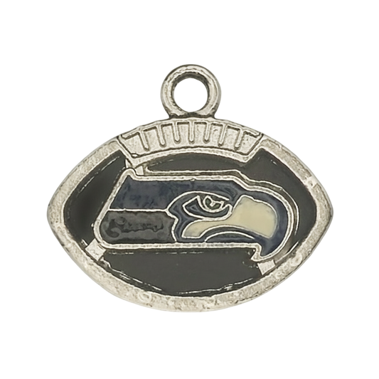 silver-tone football-shaped charm with blue and cream hawk head on black enamel